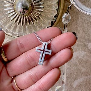 Beautiful diamond and stainless steel cross necklace